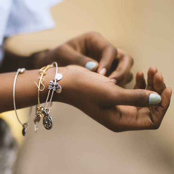 Woman wearing bracelets. Photo by Godisable Jacob from Pexels